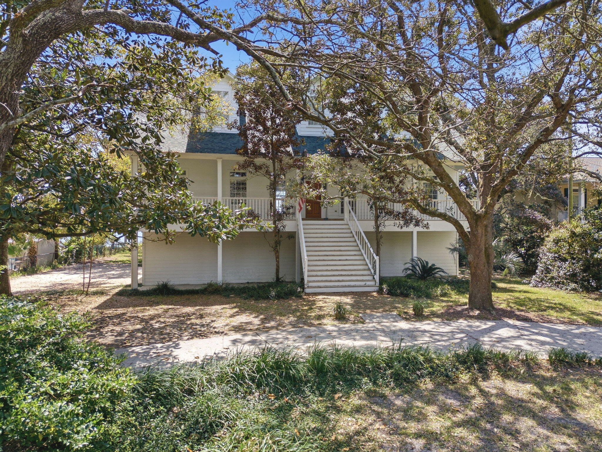 8127 Pompano Street Navarre, FL 32566 - Photo 5 of 44 a view of a house with a yard