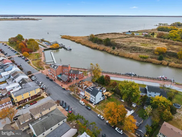 an aerial view of a house with a ocean view