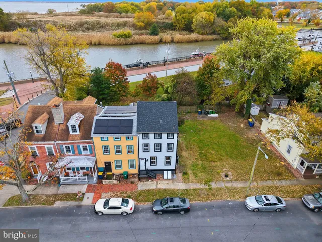 an aerial view of swimming pool with outdoor seating