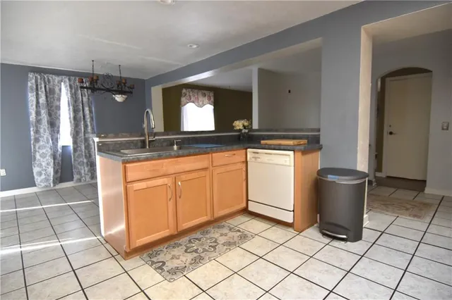 a kitchen with a sink and a stove top oven