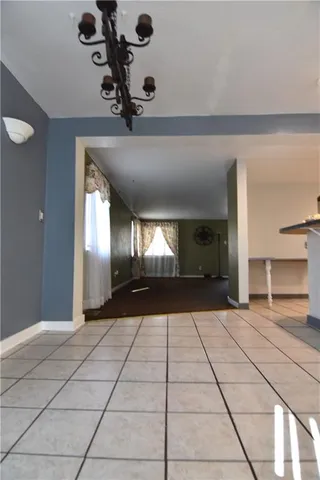 a view of a kitchen with a sink and cabinets