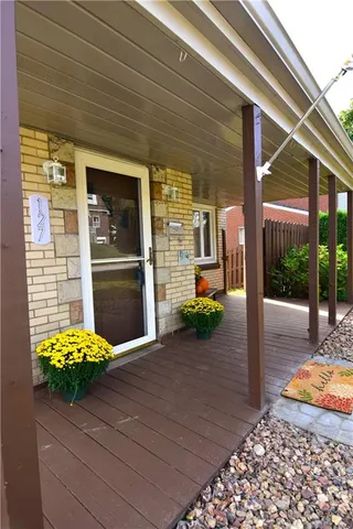 a view of a lounge chair and front door