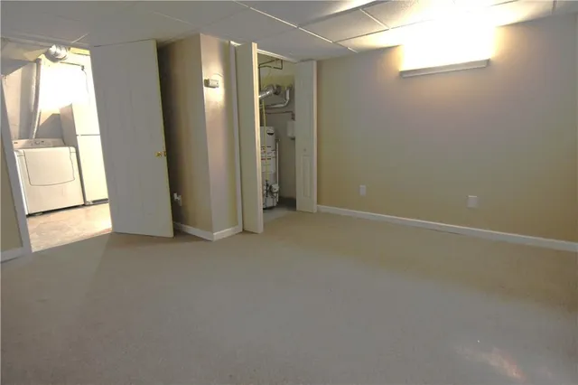 a white toilet sitting next to a bathroom sink