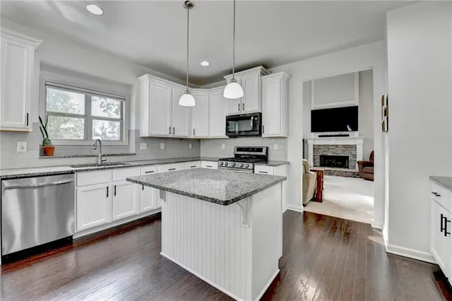 a bedroom with a bed and a dresser in it