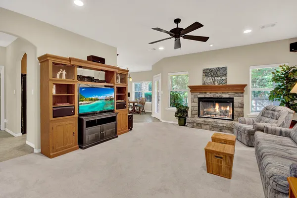 a living room with furniture and a fireplace