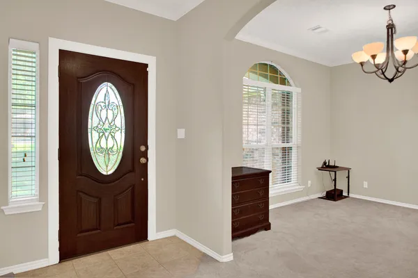 a view of a livingroom with furniture and a window