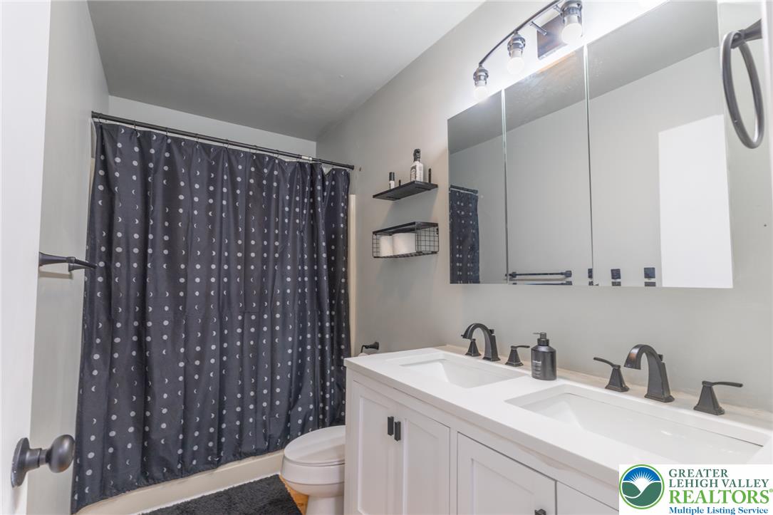 896 Briarstone Road Bethlehem, PA 18017 - Photo 17 of 26 a bathroom with a sink a toilet and shower