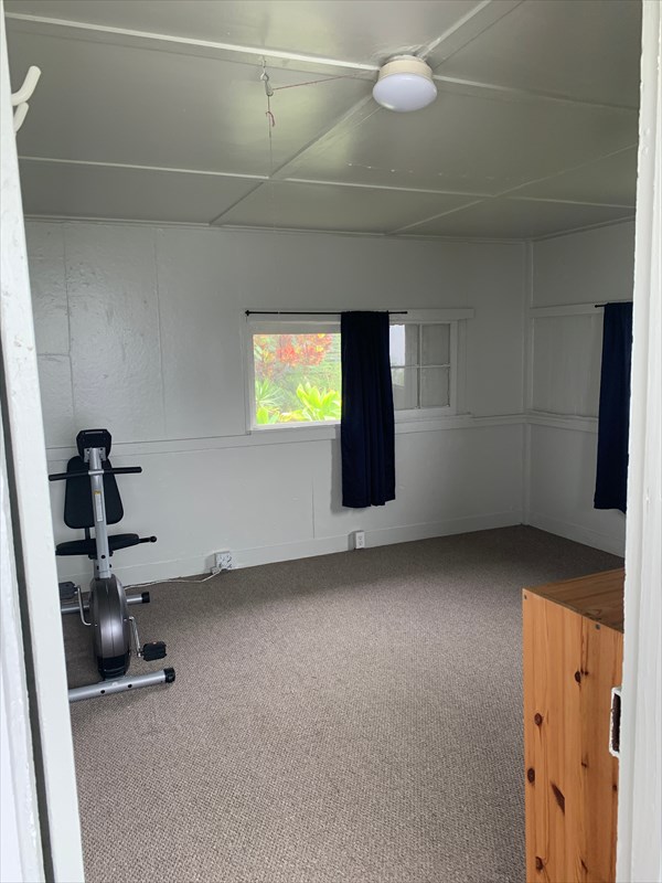 84-1180 Bruner Road Captain Cook, HI 96704 - Photo 17 of 28 a view of an empty room with a window