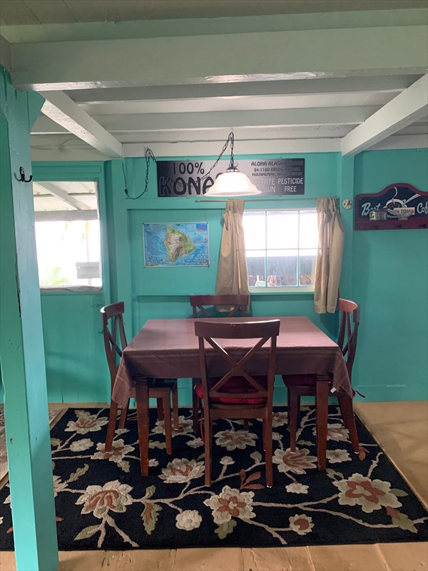 84-1180 Bruner Road Captain Cook, HI 96704 - Photo 18 of 28 a room with furniture a window and a table