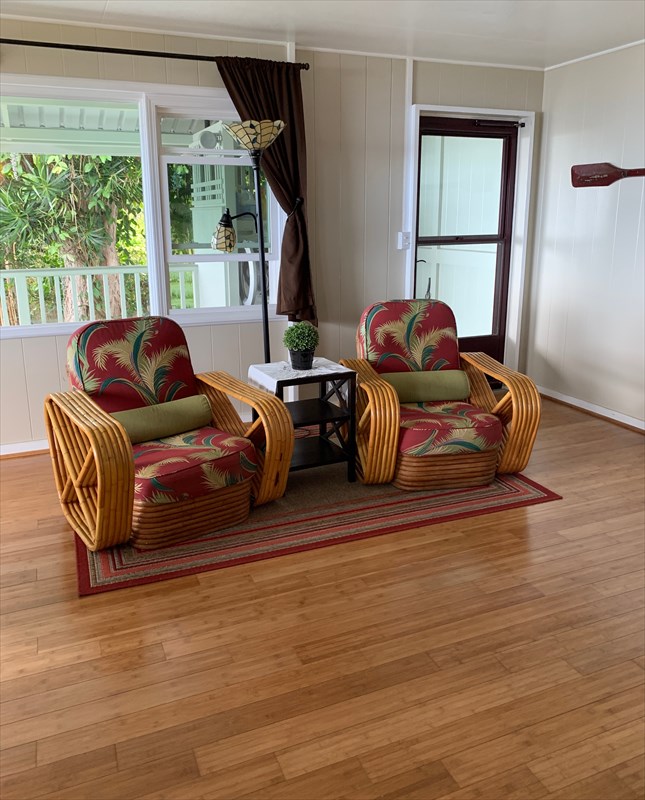 84-1180 Bruner Road Captain Cook, HI 96704 - Photo 5 of 28 a living room with furniture window and wooden floor