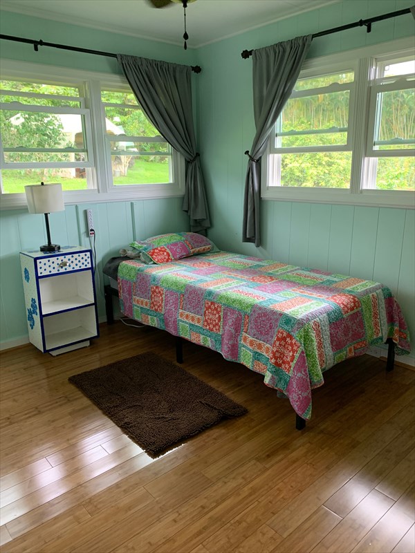 84-1180 Bruner Road Captain Cook, HI 96704 - Photo 9 of 28 a bedroom with a bed and a window
