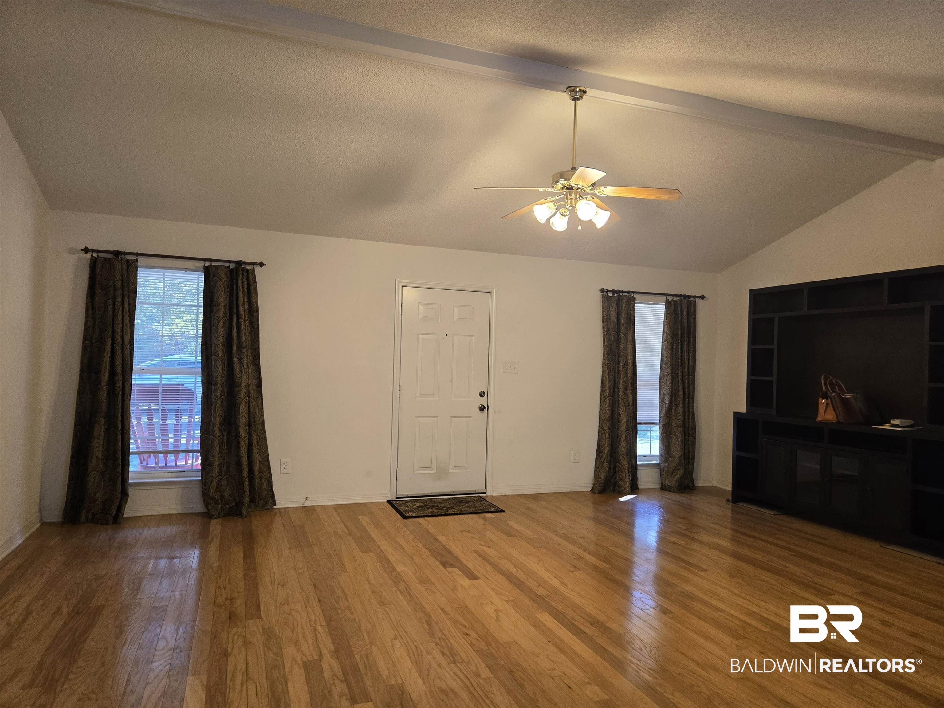 2554 Riverside Drive Mobile, AL 36605 - Photo 12 of 43 Unfurnished living room with wood finished floors and ceiling fan