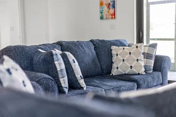 a living room with furniture and window