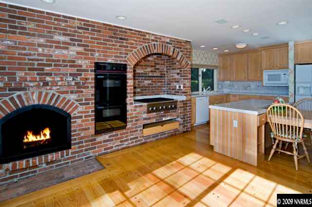2365 Tuttle Circle Reno, NV 89509 - Photo 3 of 9 a kitchen with a sink and a fireplace