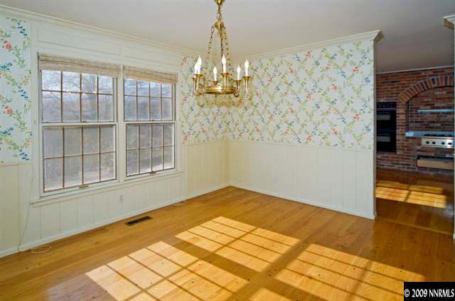 2365 Tuttle Circle Reno, NV 89509 - Photo 4 of 9 a view of empty room with window and chandelier