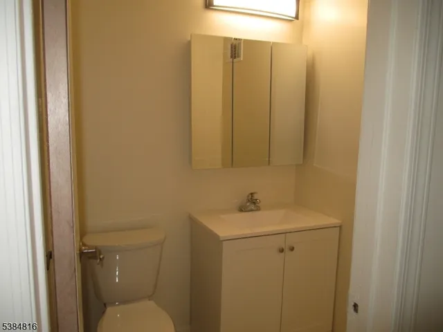 a bathroom with a sink toilet and vanity