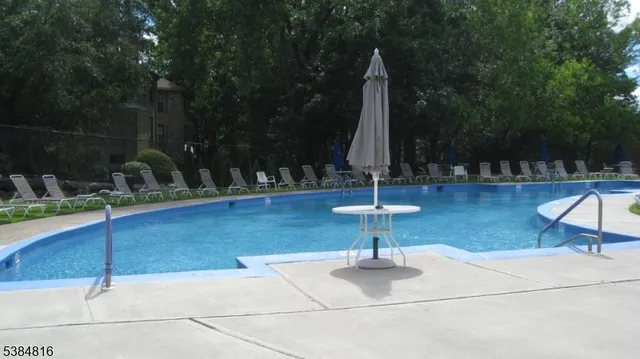 a view of swimming pool with a patio