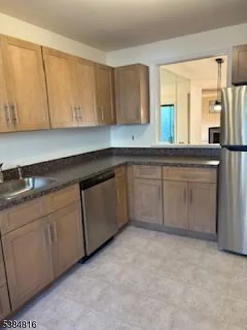 a kitchen with cabinets a sink and dishwasher