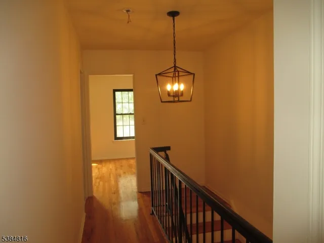 a view of a hallway with a window
