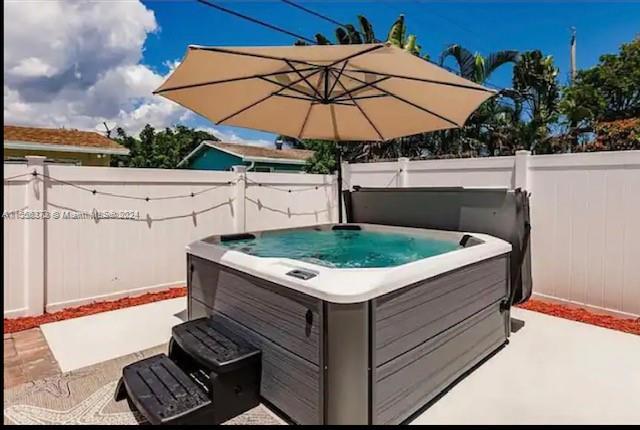a view of a jacuzzi with chairs