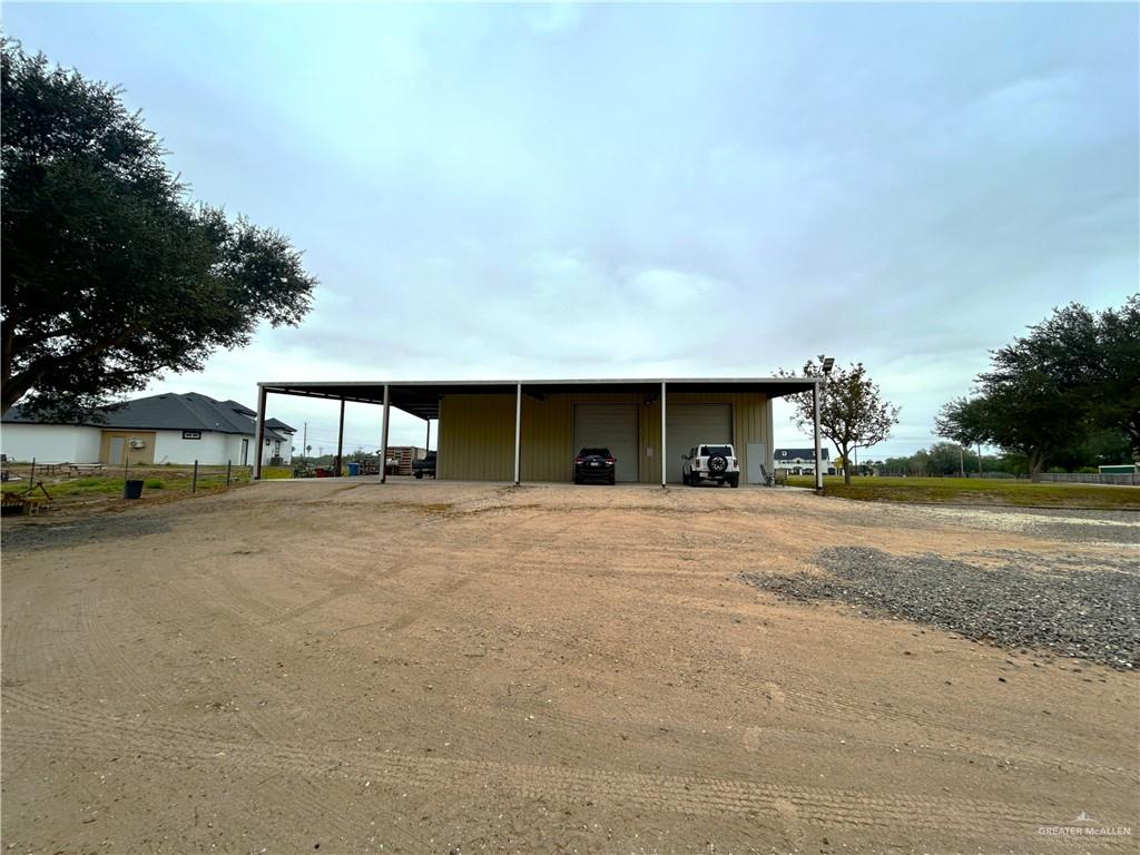 5101 Mile 8 Road Edinburg, TX 78541 - Photo 1 of 18 a view of a house with a yard and garage