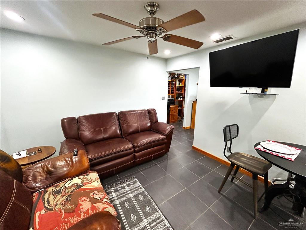 5101 Mile 8 Road Edinburg, TX 78541 - Photo 4 of 18 a living room with furniture and a flat screen tv