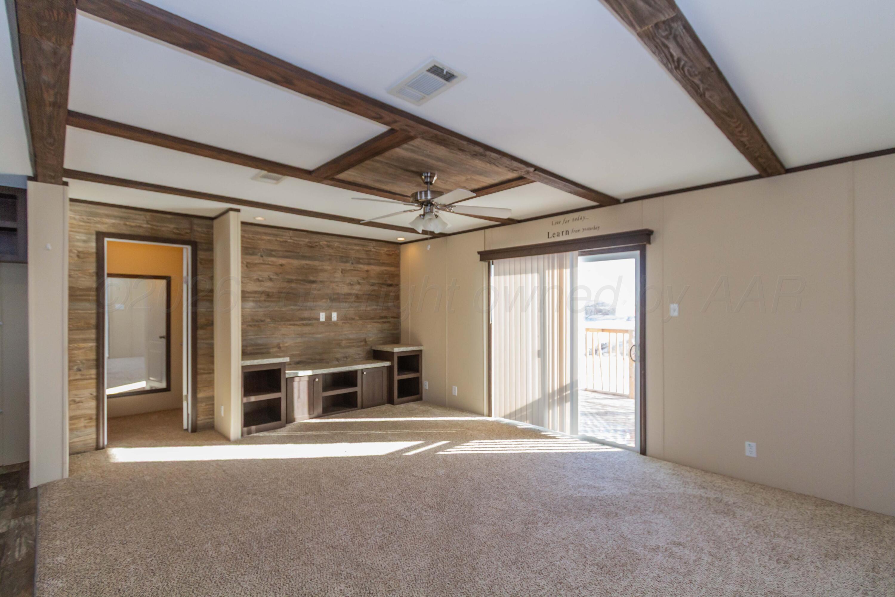 108 North Canadian Street Wheeler, TX 79096 - Photo 11 of 42 wooden floor in an empty room with a fireplace