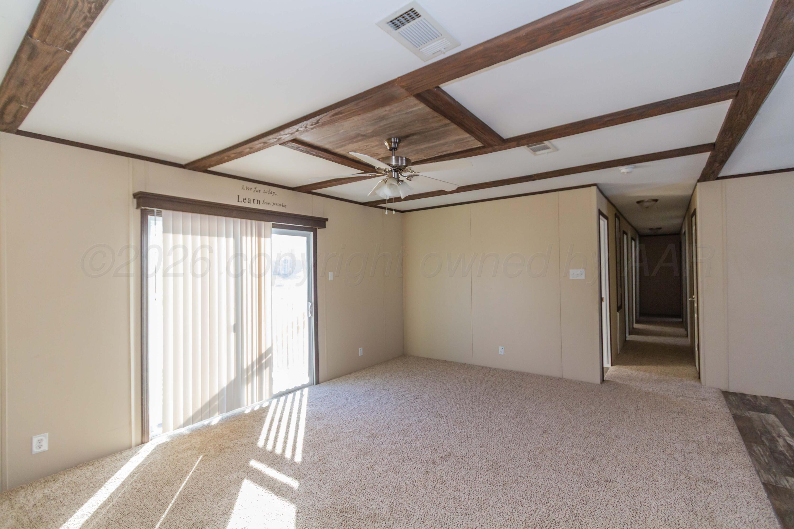 108 North Canadian Street Wheeler, TX 79096 - Photo 13 of 42 an empty room with windows