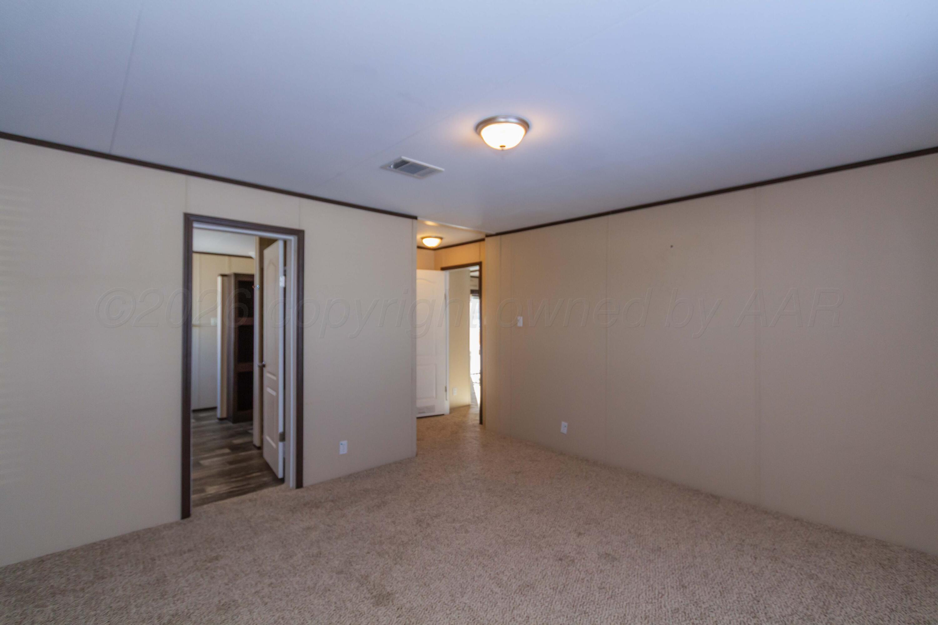 108 North Canadian Street Wheeler, TX 79096 - Photo 16 of 42 an empty room with closet and a window