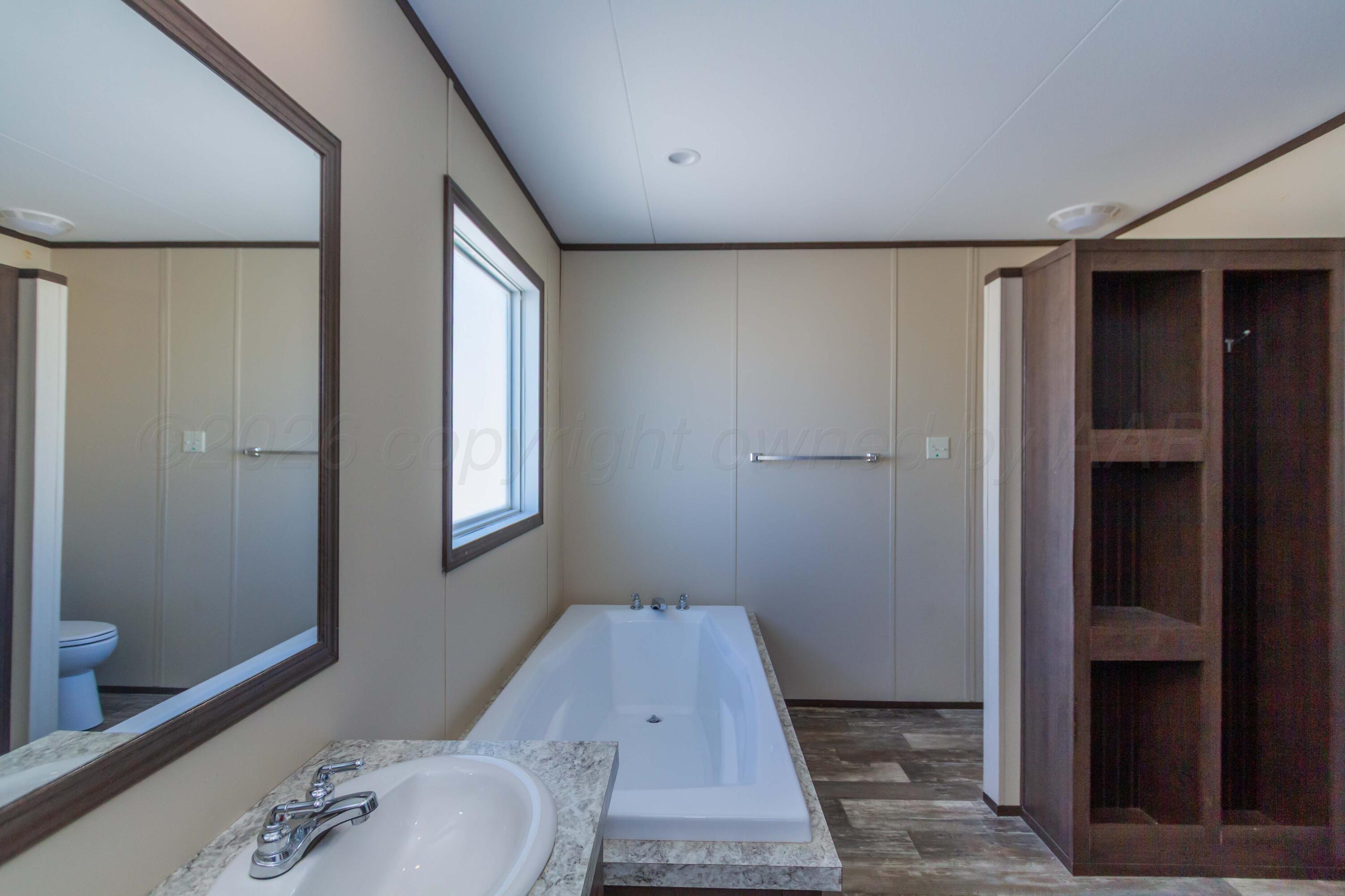 108 North Canadian Street Wheeler, TX 79096 - Photo 18 of 42 a bathroom with a sink and toilet