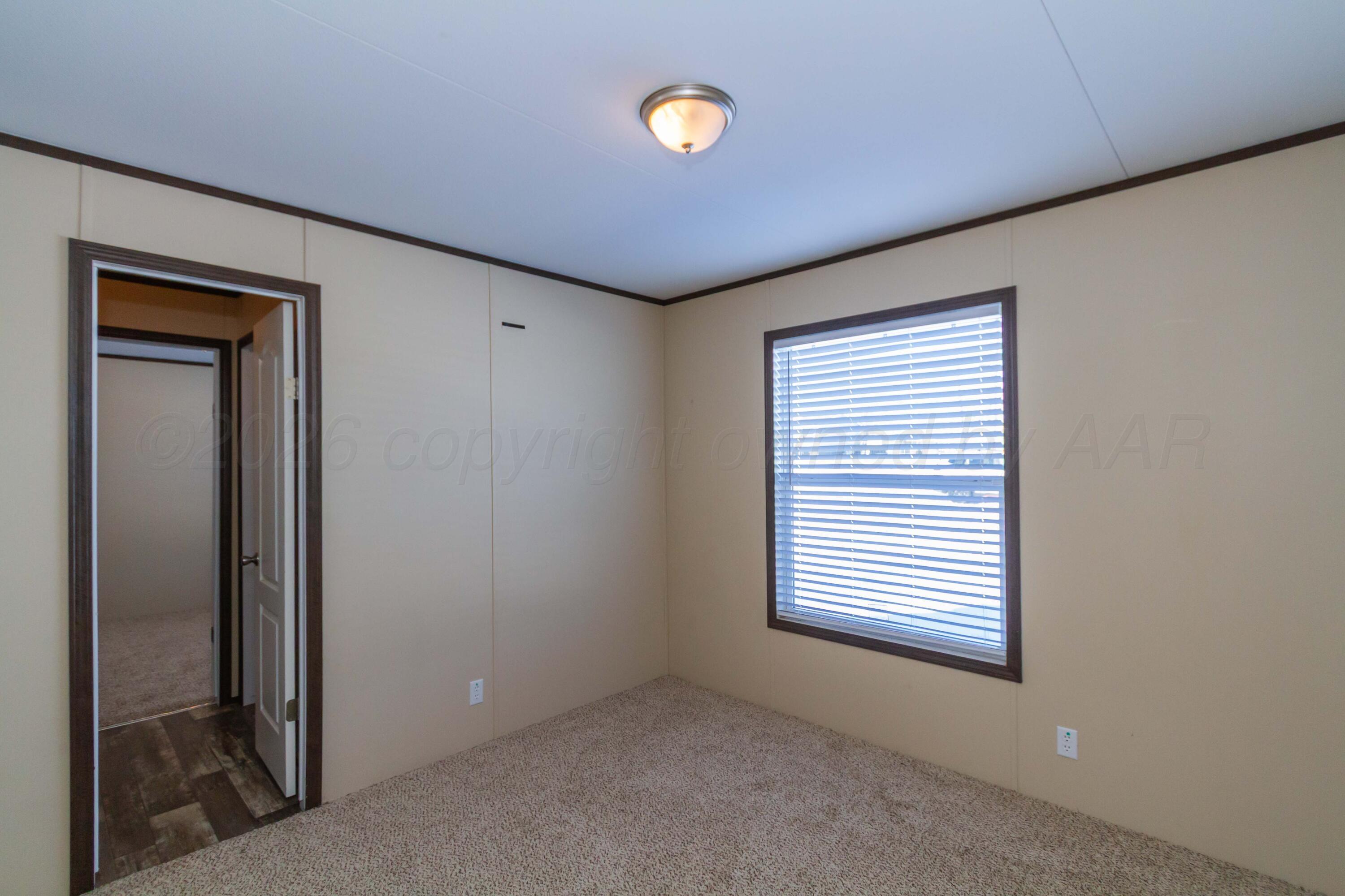 108 North Canadian Street Wheeler, TX 79096 - Photo 30 of 42 a view of an empty room with a window