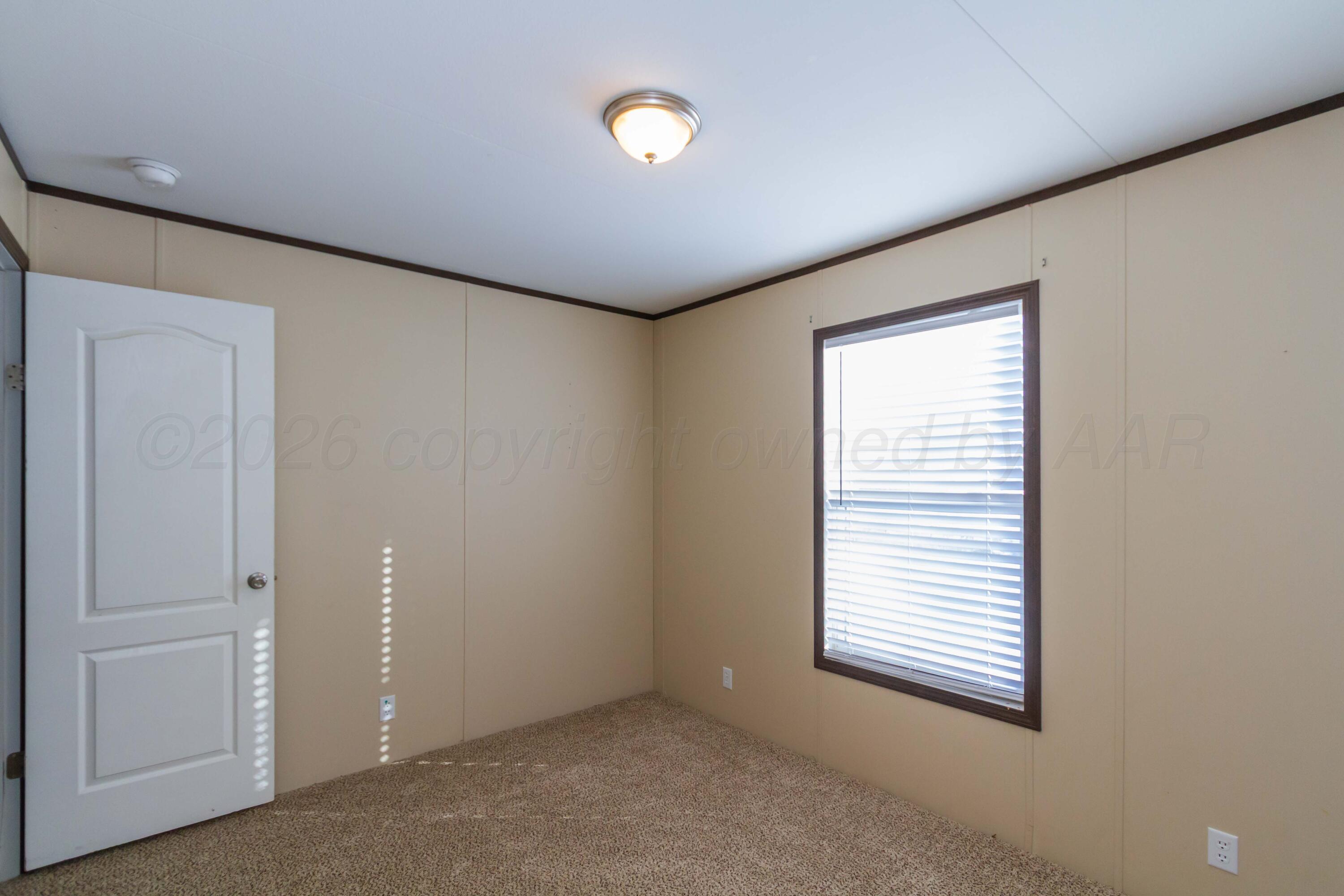 108 North Canadian Street Wheeler, TX 79096 - Photo 37 of 42 a view of an empty room with a window and closet area