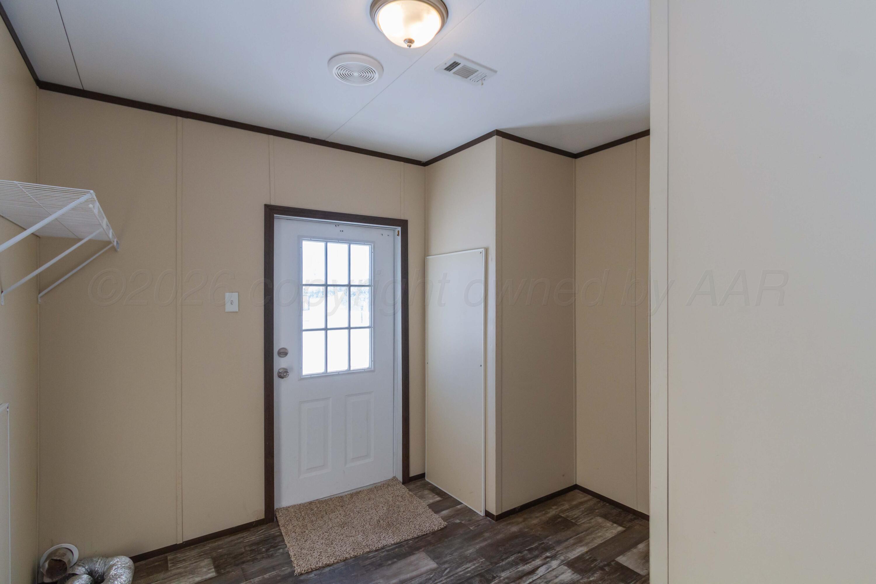 108 North Canadian Street Wheeler, TX 79096 - Photo 38 of 42 a view of livingroom with hardwood floor and window