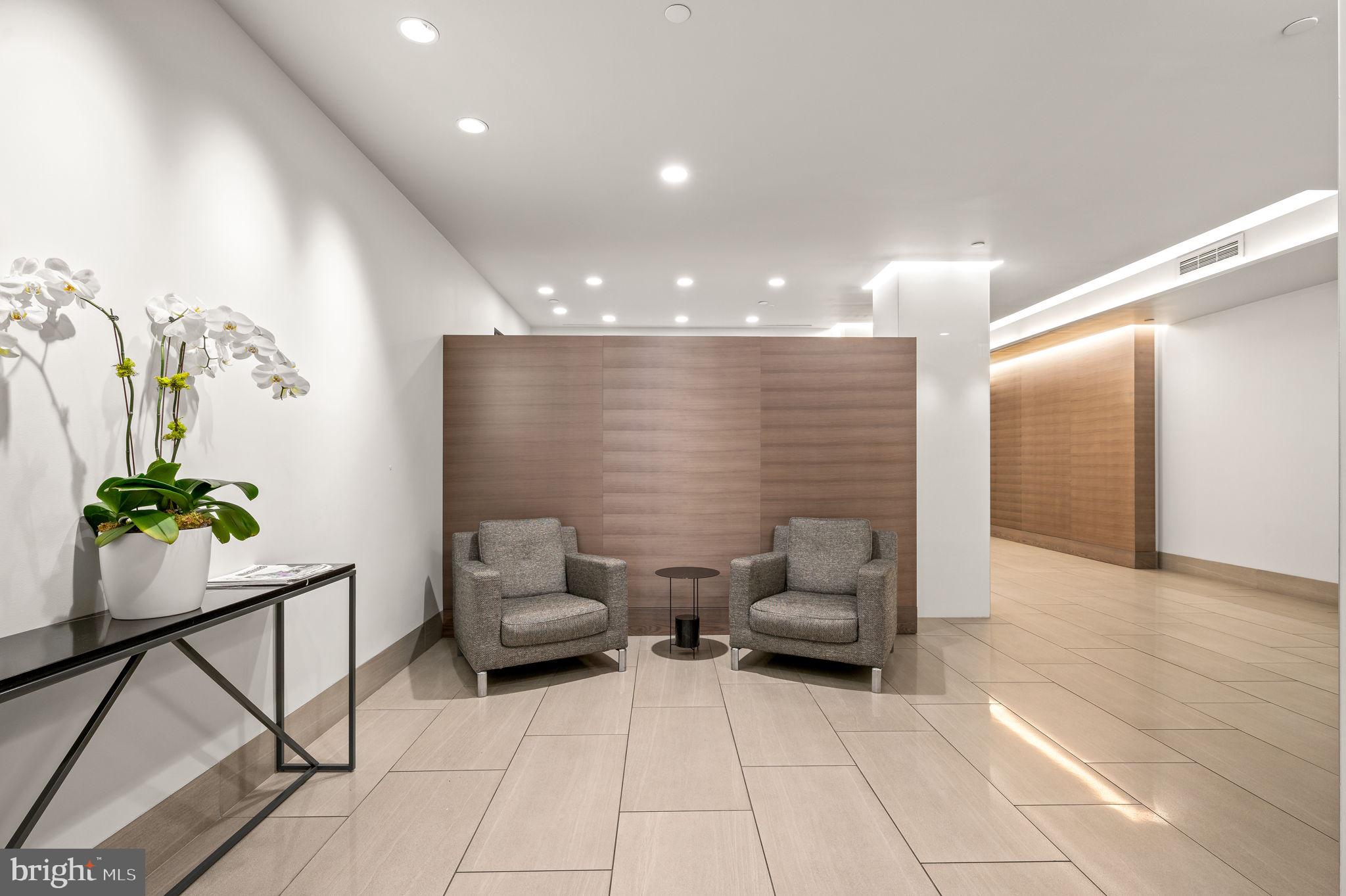 2020 Walnut Street, Unit 6C Philadelphia, PA 19103 - Photo 22 of 25 a lobby with furniture and potted plant