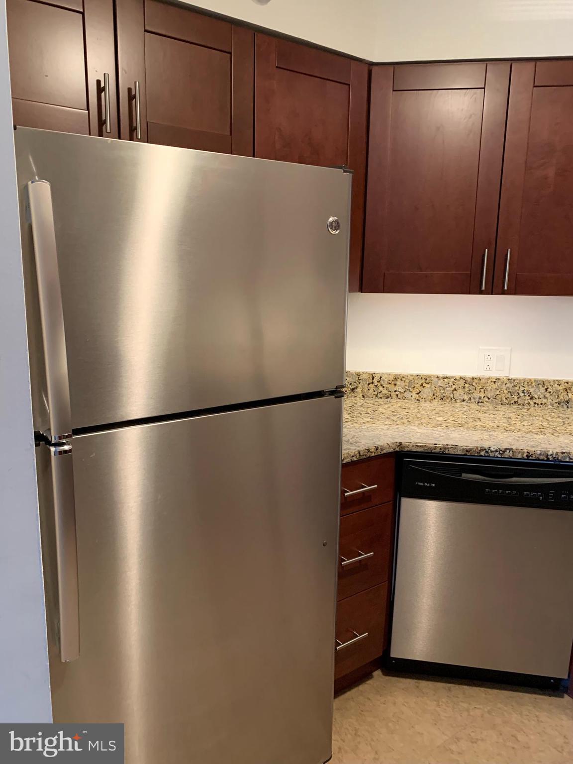 2020 Walnut Street, Unit 6C Philadelphia, PA 19103 - Photo 6 of 25 a white refrigerator freezer sitting in a kitchen