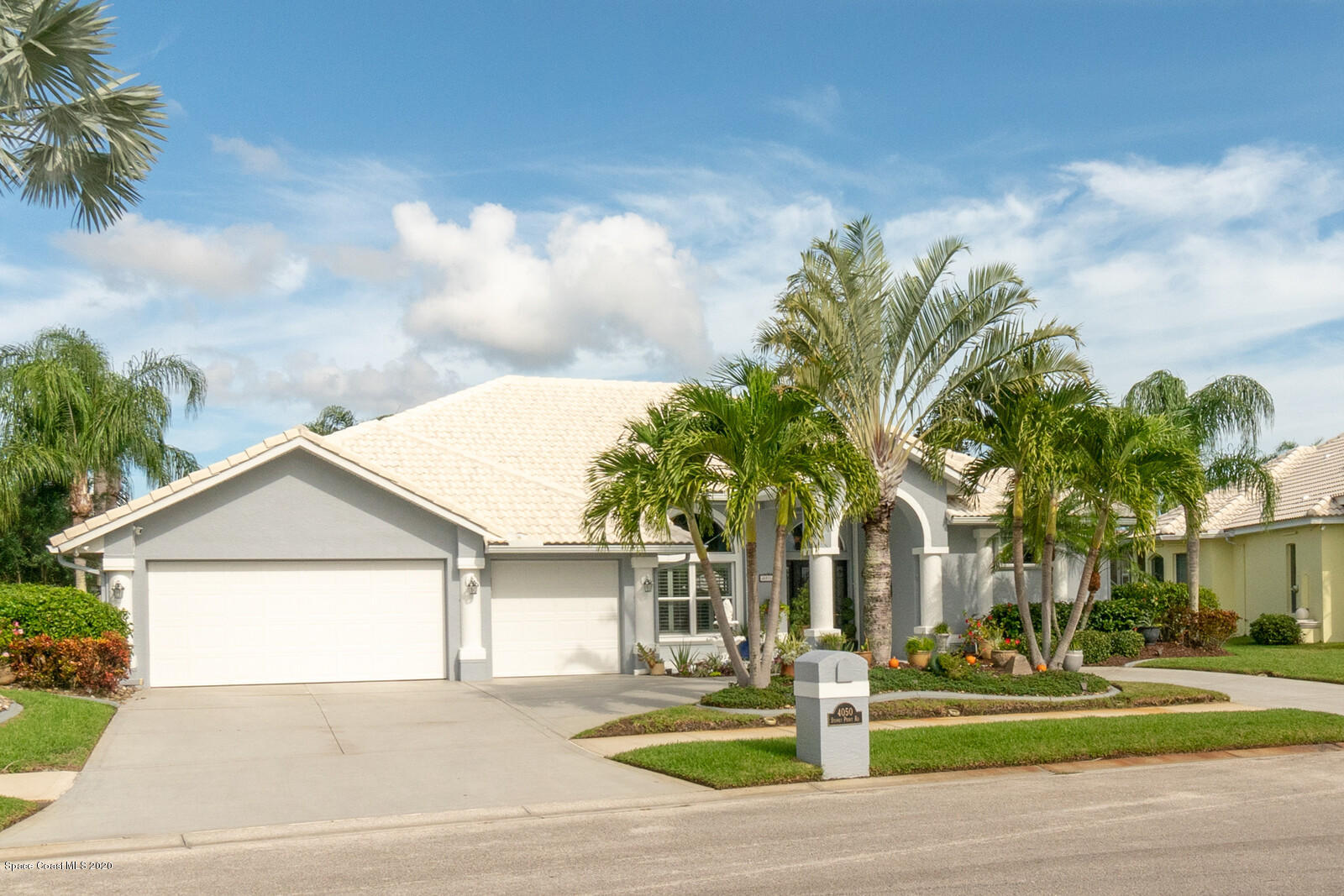 4050 Stoney Point Road Melbourne, FL 32940 - Photo 1 of 52 a front view of a house with a yard
