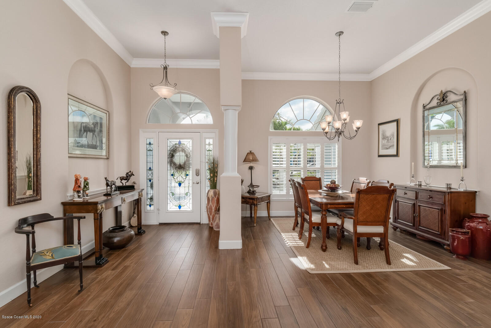 4050 Stoney Point Road Melbourne, FL 32940 - Photo 11 of 52 a view of a dining room with furniture window and wooden floor