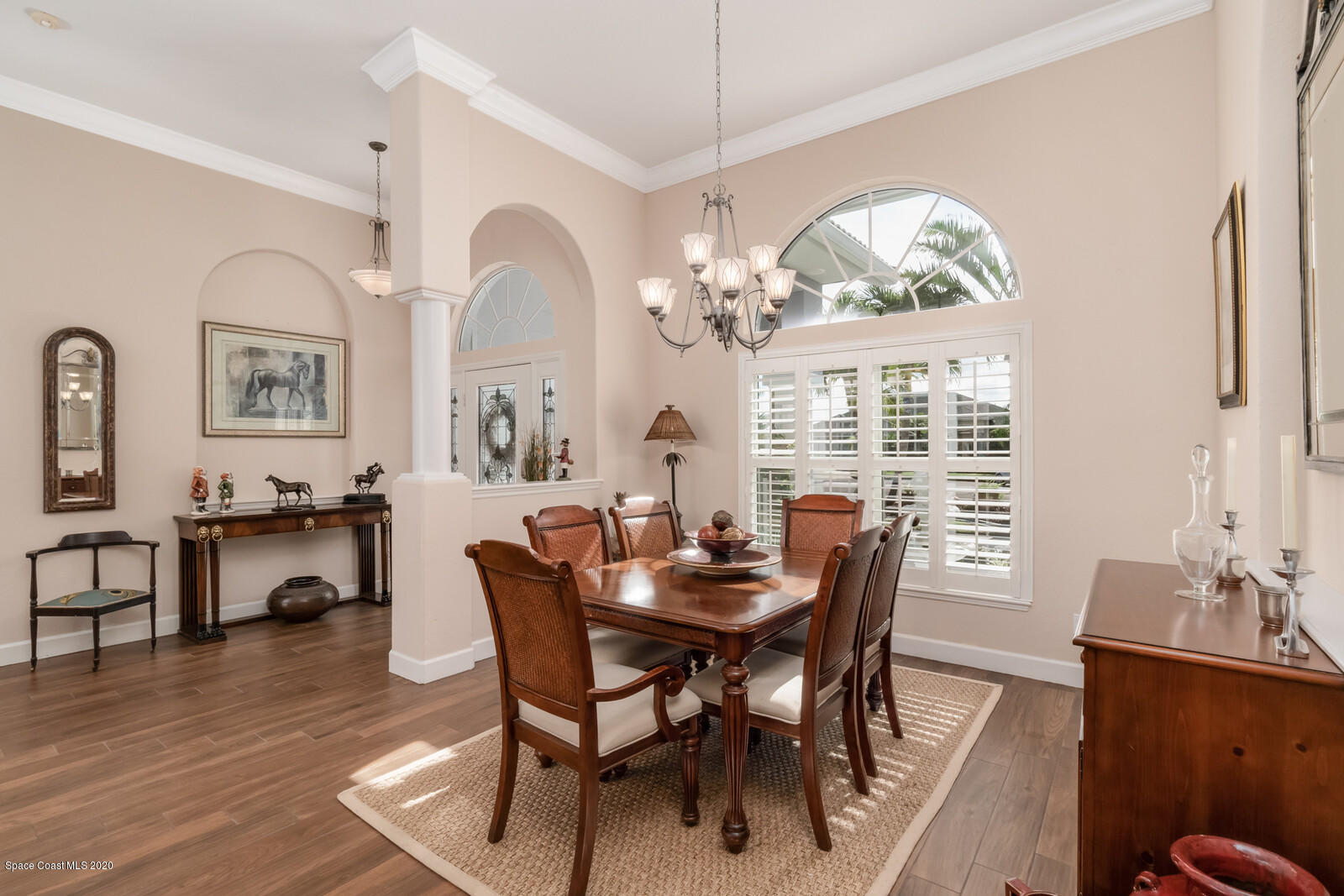 4050 Stoney Point Road Melbourne, FL 32940 - Photo 13 of 52 a view of a dining room with furniture window and wooden floor