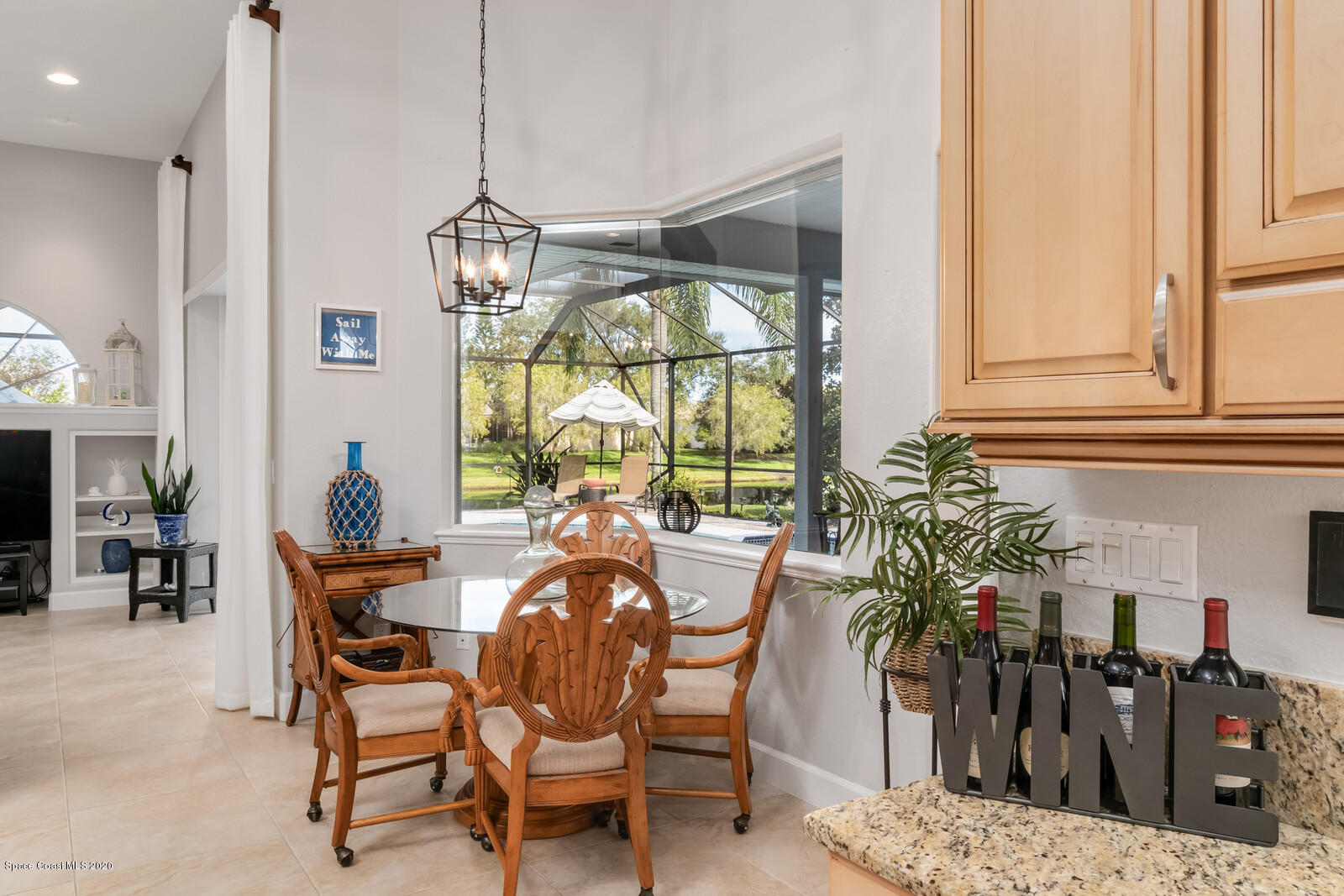 4050 Stoney Point Road Melbourne, FL 32940 - Photo 17 of 52 a dining room with furniture window and outside view