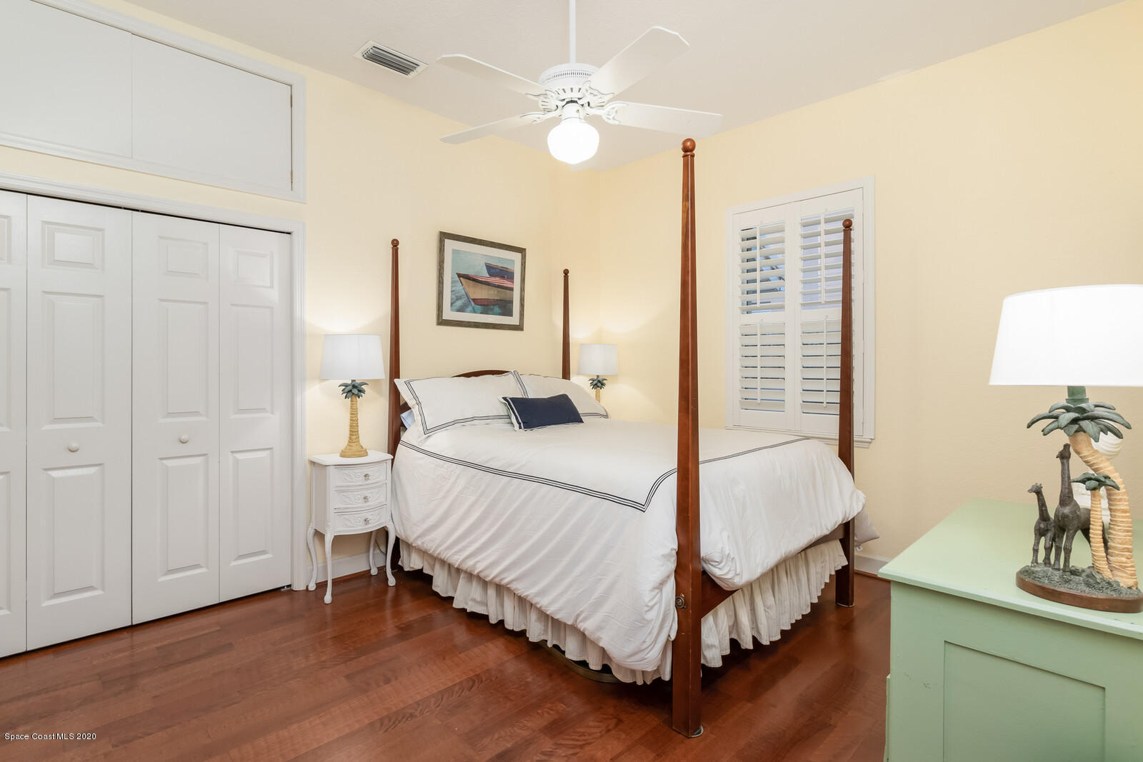 4050 Stoney Point Road Melbourne, FL 32940 - Photo 30 of 52 a bedroom with a bed and a table in it