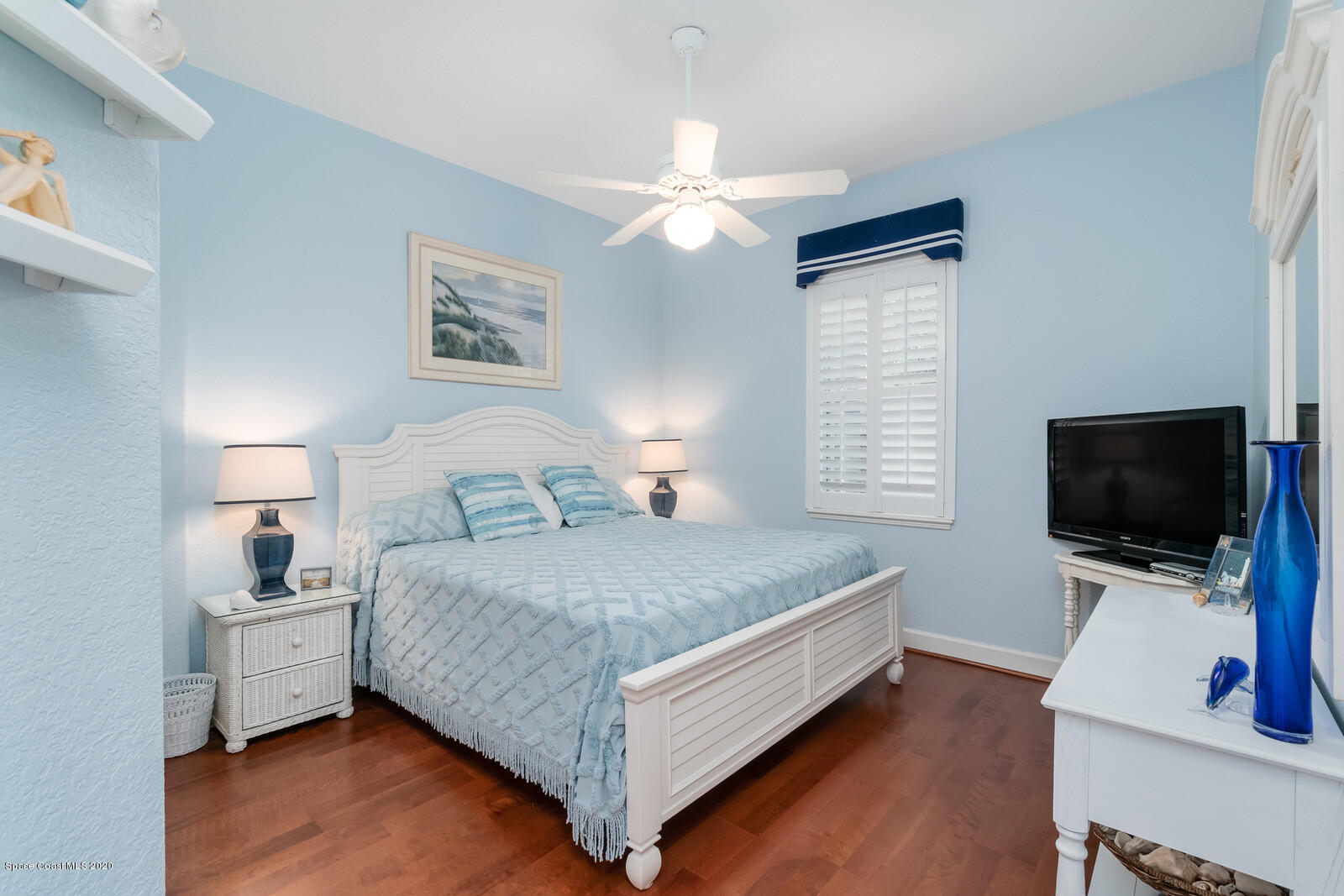 4050 Stoney Point Road Melbourne, FL 32940 - Photo 33 of 52 a bed room with a bed and a flat tv screen on a dresser