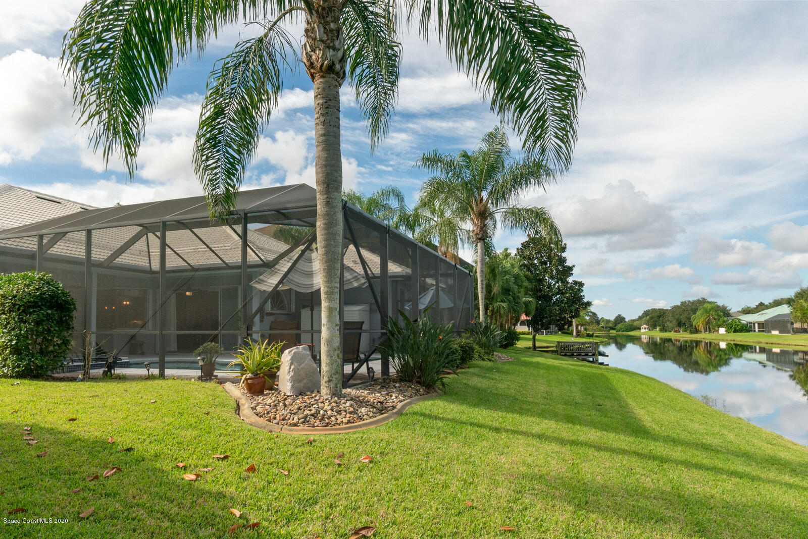 4050 Stoney Point Road Melbourne, FL 32940 - Photo 45 of 52 a view of a house with backyard and a swimming pool