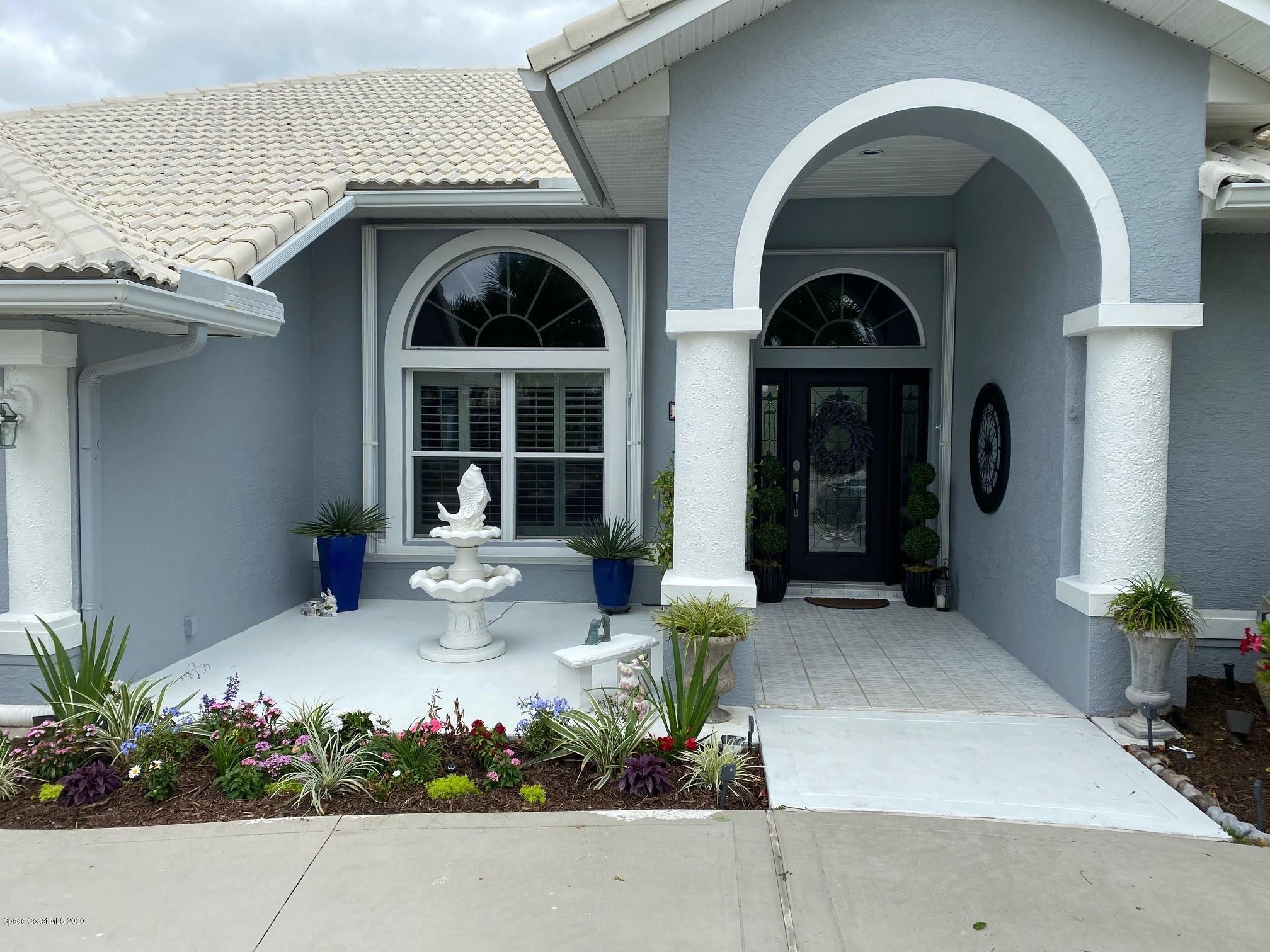 4050 Stoney Point Road Melbourne, FL 32940 - Photo 49 of 52 a view of a house with potted plants