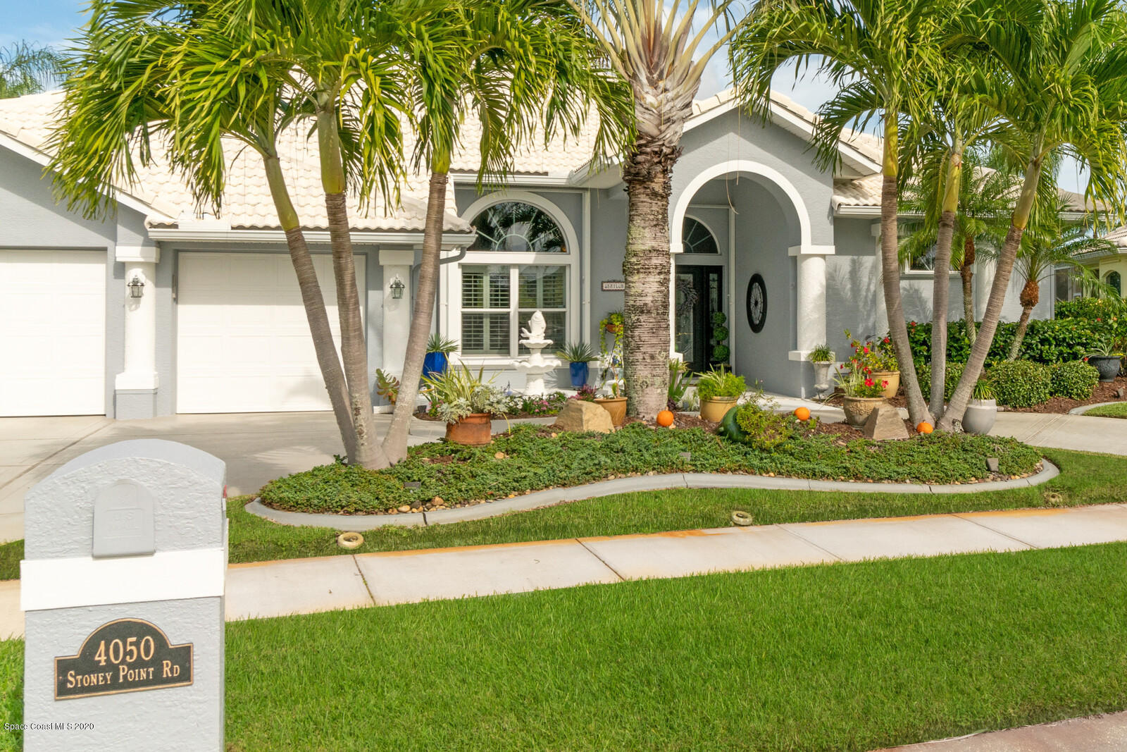 4050 Stoney Point Road Melbourne, FL 32940 - Photo 50 of 52 a front view of a house with garden