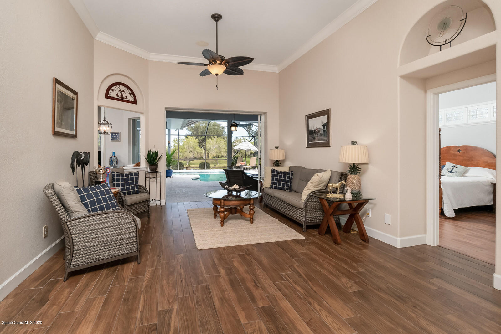 4050 Stoney Point Road Melbourne, FL 32940 - Photo 9 of 52 a living room with furniture and wooden floor
