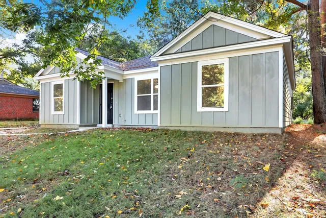a house with trees in front of it