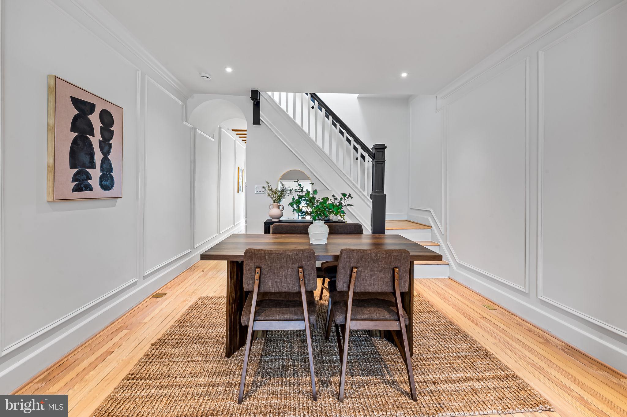 832 Union Avenue Baltimore, MD 21211 - Photo 11 of 43 a view of a dining room with furniture and wooden floor