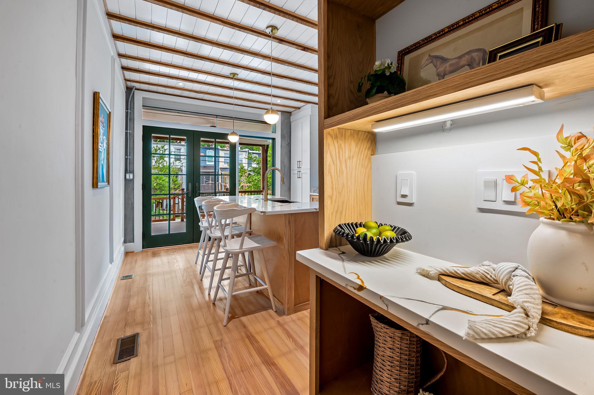 832 Union Avenue Baltimore, MD 21211 - Photo 14 of 43 a view of a dining room with furniture and wooden floor