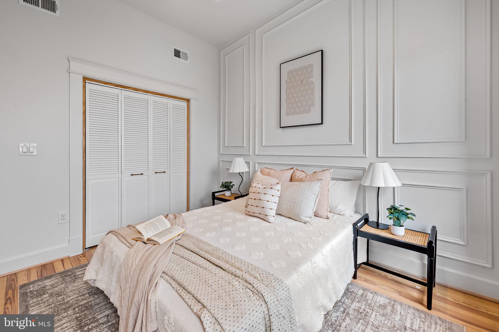 832 Union Avenue Baltimore, MD 21211 - Photo 22 of 43 a bedroom with a bed and a potted plant