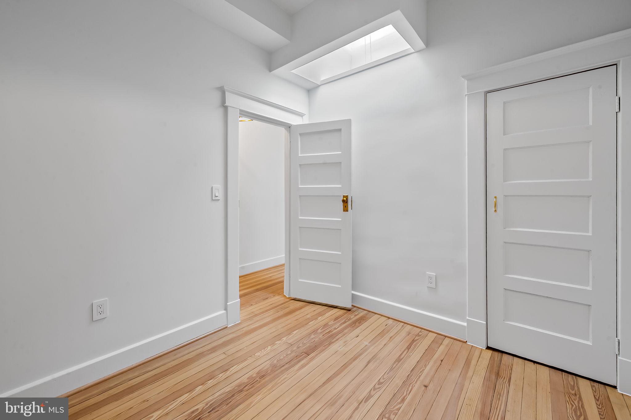 832 Union Avenue Baltimore, MD 21211 - Photo 25 of 43 a view of an empty room with wooden floor